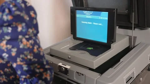 Lady placing vote on electronic voting machine. Stock Footage 270285556