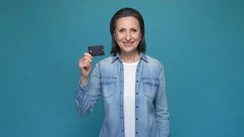 Lady point debit card recommend service isolated blue color background Stock Footage 167319501