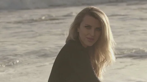 Lady posing to camera on the beach Stock Footage 88323329