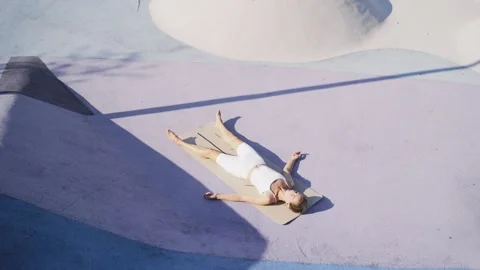 Lady practicing Dead Body Corpse Pose ,Shavasana Stock Footage 260784842