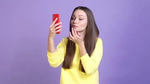 Lady prepare event use gadget look mirror isolated shine color background Video stock 169997457