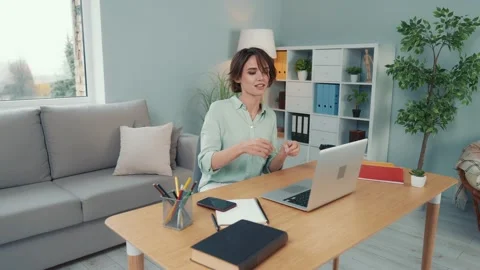 Lady prepare project netbook break pause lying couch in modern workspace Stock Footage 168347970