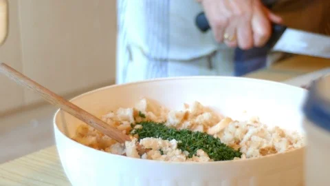 Lady prepares the dough for the typical Tyrolean dumplings Stock Footage 95186159