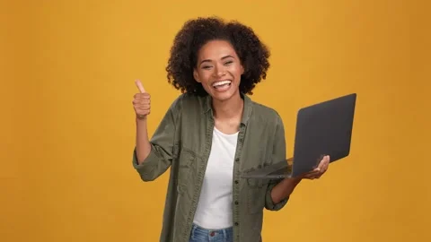 Lady programmer point netbook social media isolated mustard color background Stock Footage 166161565