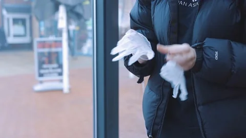 Lady putting on gloves at work Stock-Footage 151014693