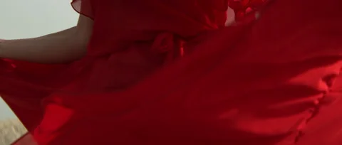 Lady in Red Dress Turning Around the Dress is Flying in Slow Motion Close Stock Footage