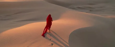 Lady in Red: Elegance in the Desert Stock Footage 276138448