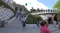 Lady in red shirt at the main entrance to Park Guell, Barcelona 4k or 4k+ Resolution