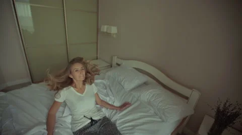 Lady resting in her bedroom Stock Footage 68735176