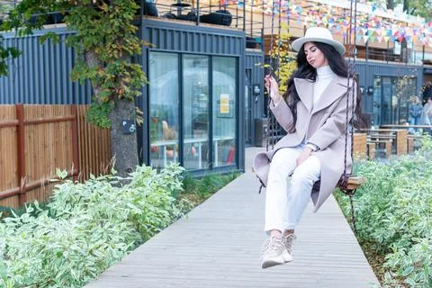 Lady is riding a swing Stock Photos