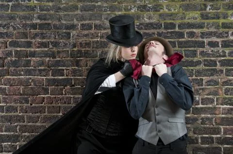 Lady ripper strangling man Stock Photos
