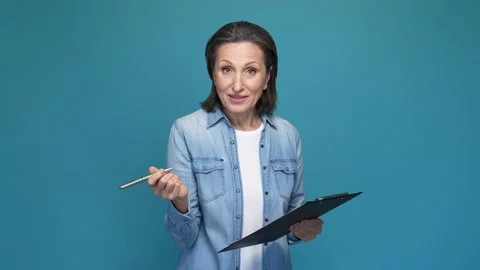 Lady secretary write document clip board isolated blue color background Stock Footage 167321443