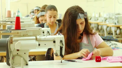 Lady Sewing on sewing mashine Stock Footage 64802011