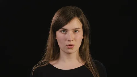 A Lady Shouting Against a Black Background Stock Footage 87188617