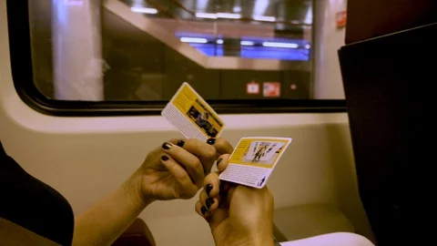 Lady shows tickets while on train to downtown Amsterdam Stock Footage 117939831