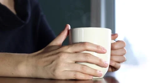 Lady sips coffee Stock Footage 62945352