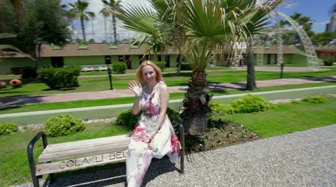 Lady sitting of a bench. Stock Footage 49826000