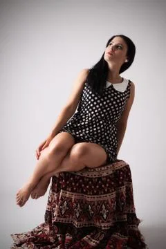 Lady sitting on sofa Stock Photos