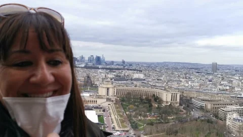 Lady smiling at the camera with her face mask down at the very top of the Stock Footage 172470985