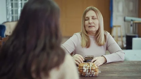 Lady spends leisure time drinking hot tea with adult woman Video stock 126583676