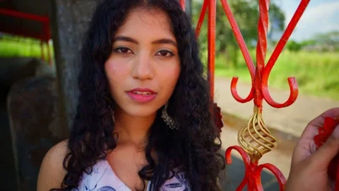 Lady stands facing the camera posing for shot Video stock 300964878