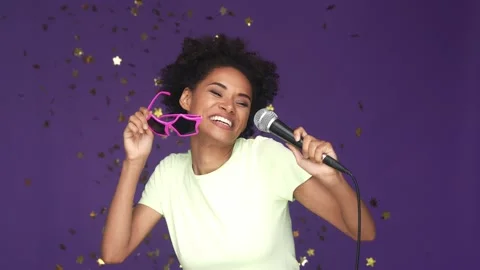 Lady star shape sunglass sing fall confetti isolated purple color background Stock Footage 165878745