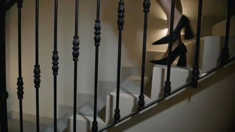 Lady stepping down stairs medium shot Stock Footage 339843218