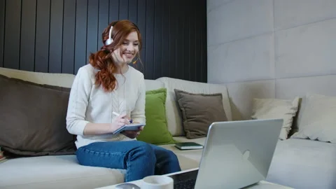 Lady Student Learning Using Computer Webcam Chat Makes Notes. Distance education Stock Footage 153081278