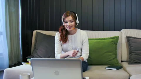 Lady Student Learning Using Computer Webcam Chat Makes Notes. Distance education Stock Footage 166507567