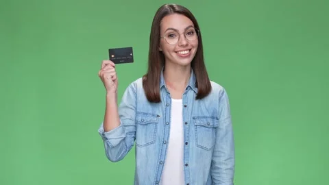 Lady suggest use nfc pay hold credit card isolated green color background Stock Footage 166043819