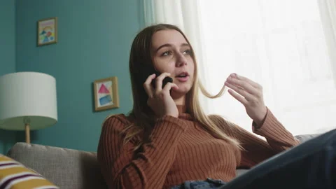 Lady is talking on a cell phone Stock Footage 146947308