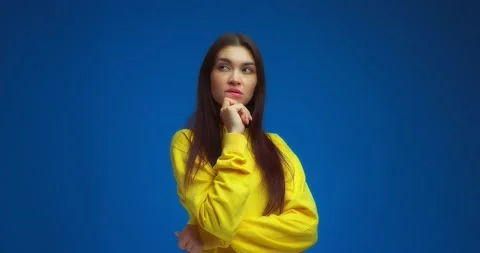 Lady is thinking about something, holding her hand on her chin, making plans Stock Footage 195935567