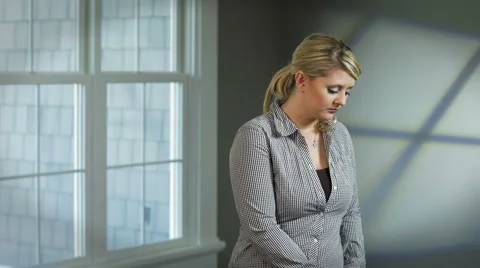 Lady throws cigarette pack away Stock Footage 938976