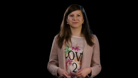 A Lady With Thumbs Up Against a Black Background Stock Footage 86577989