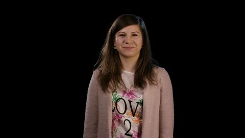 A Lady With Thumbs Up Against a Black Background Stock Footage 86579425