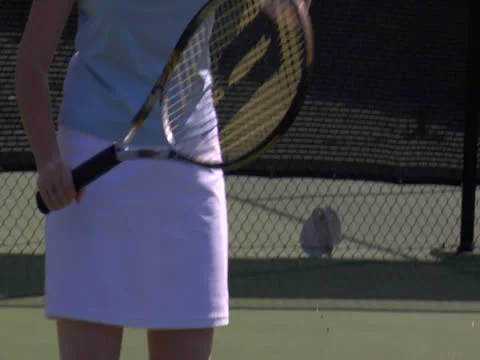 A lady is tossing the ball for flat serve and hitting it in close Stock Footage 22892171