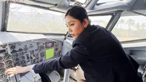 Lady trainee pilot operates aircraft controls Stock Footage 304850584