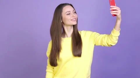 Lady try blogger app make selfie thumb up isolated bright color background Stock Footage 169997127