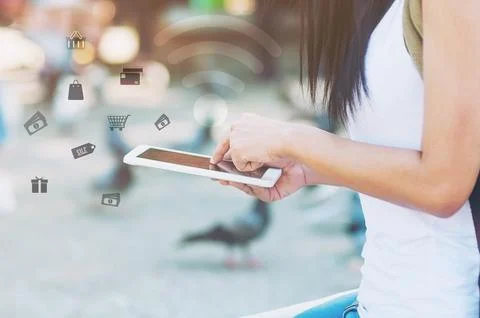 Lady use mobile tablet making online activity while traveling in asian city - Stock Photos