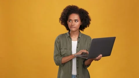 Lady use netbook think post win bet fists up isolated mustard color background Stock Footage 166162215