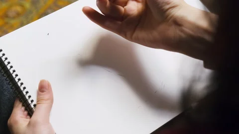 Lady uses sketching technique to create painting in studio Stock Footage 316143432