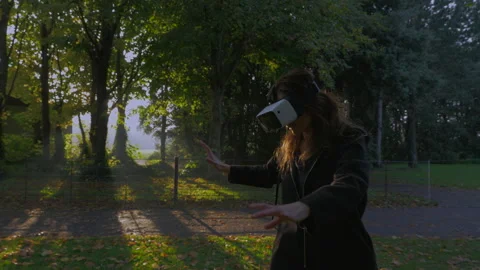 Lady With VR Set In Green Park Stock Footage 131996295