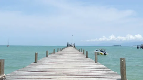 Lady walk on jetty Stock Footage 57991580