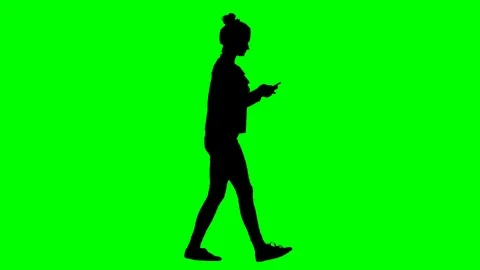Lady Walking and Texting on Smartphone While Walking Green Screen Silhouette Stock Footage 126012004