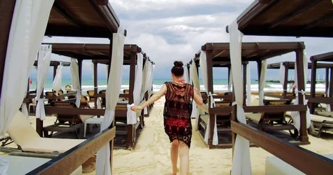 Lady walking to the beach Stock Footage 90361891