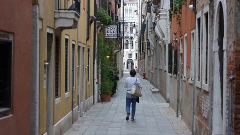 Lady Walking Down Street Stock Footage 87605487