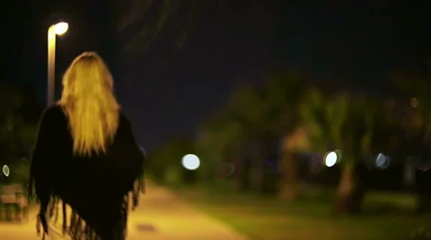 Lady walking in the night. Stock Footage 49819805