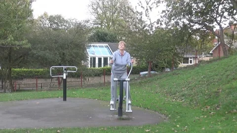 Lady walking on a training apparatus Stock Footage 88102577