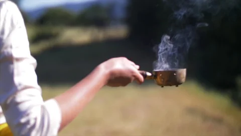 Lady walks with incense burning. Stock Footage 90398599