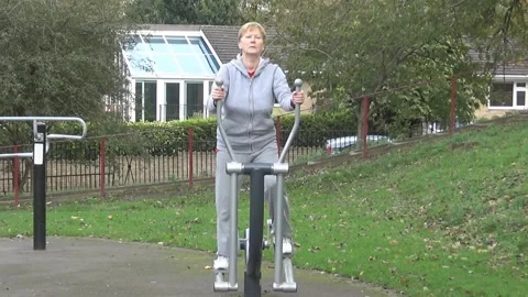 Lady walks on a training machine Stock Footage 88528810